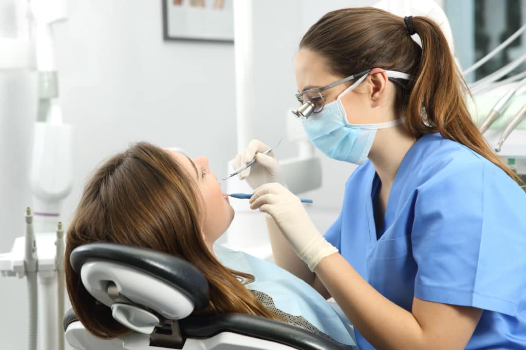 Dentist Examining Patient